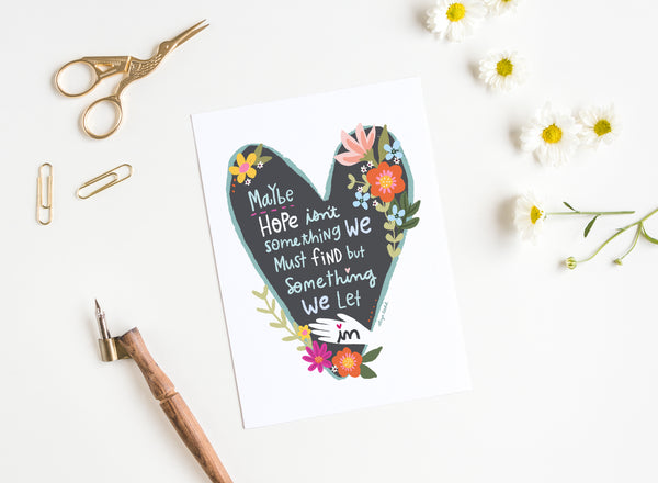 5x7 Greeting card by Eliza Todd featuring flowers in a grey heart, saying "Maybe hope isn't something we must find, but something we let in." - APeaceofWerk.com