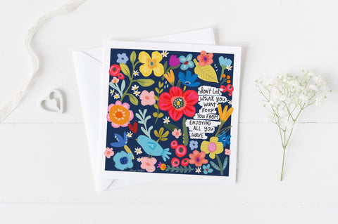 5x5 greeting card by Eliza Todd featuring colorful flowers saying "Don't let what you want keep you from enjoying all you have." - APeaceofWerk.com